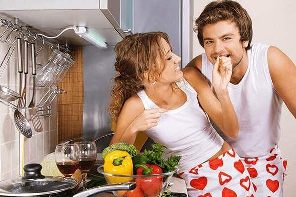 a woman feeds a man potency-enhancing products